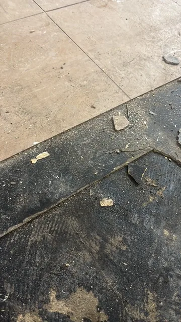 Black bitumen mastic floor removal in a NW4 flat